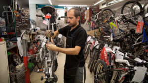 A mechanic repairs bike at Calmera bike shop in Madrid_Sept.2013